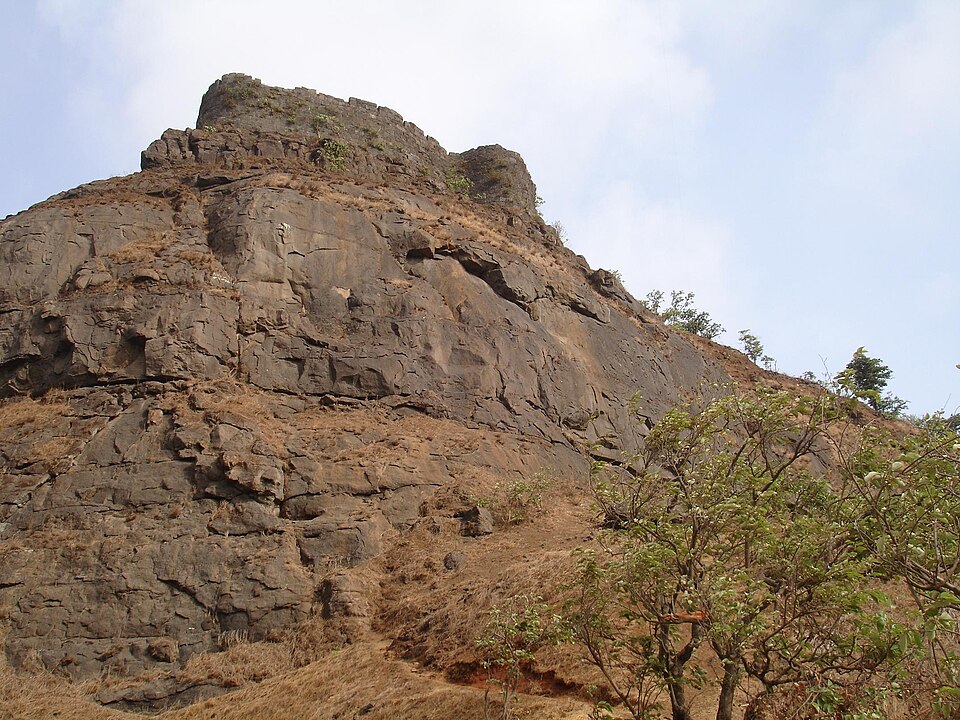 Rocky ascent and fort walls at Peb Fort, also known as Vikatgad